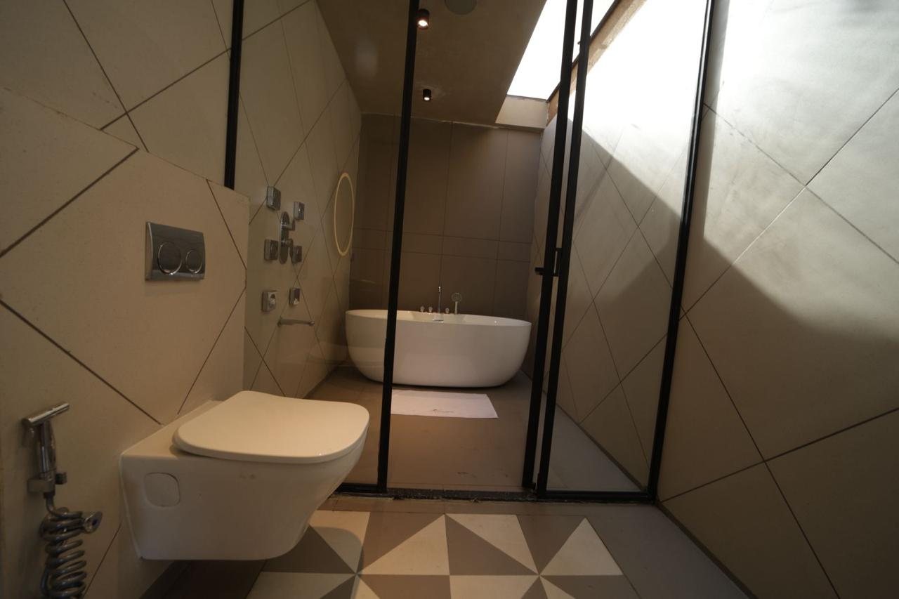 Bathroom with freestanding tub under a skylight