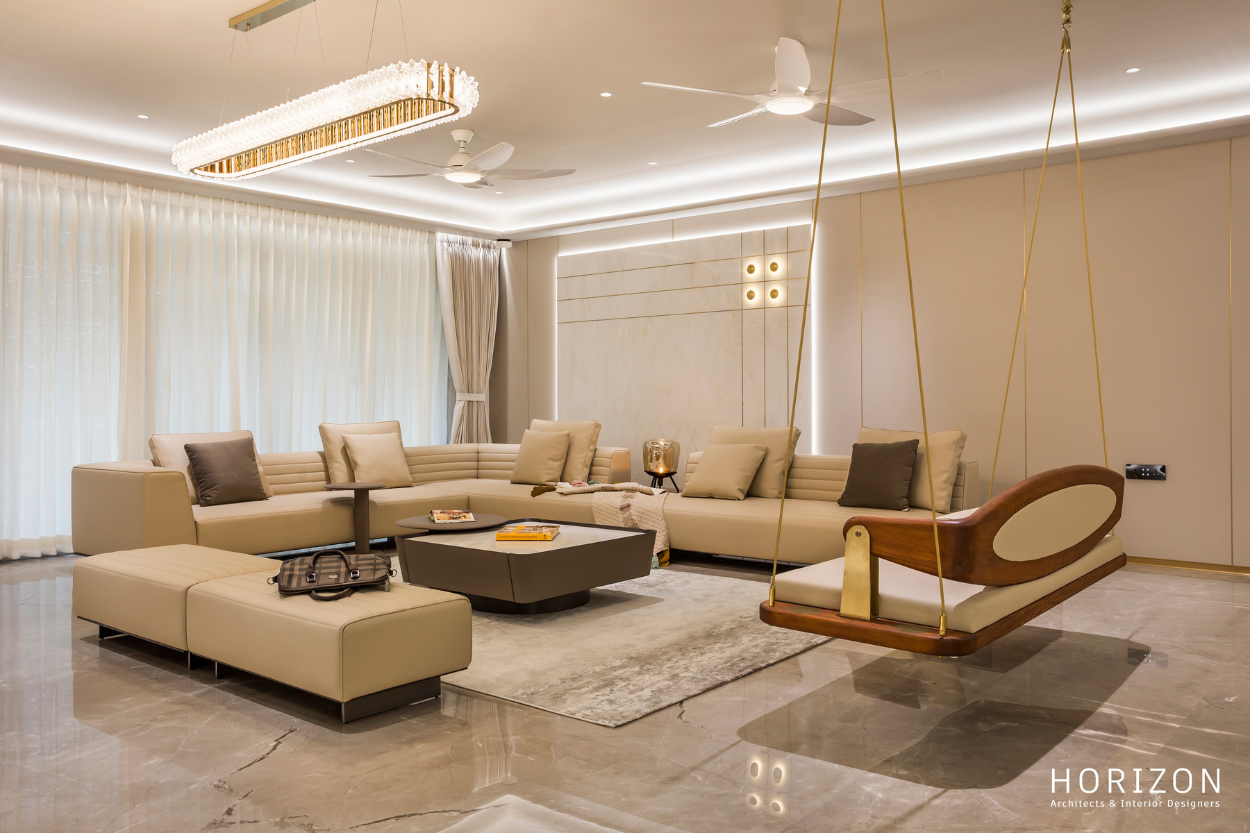 RAHUL BHAI HOME sectional sofa beside the brass-roped teak swing with upholstered seat