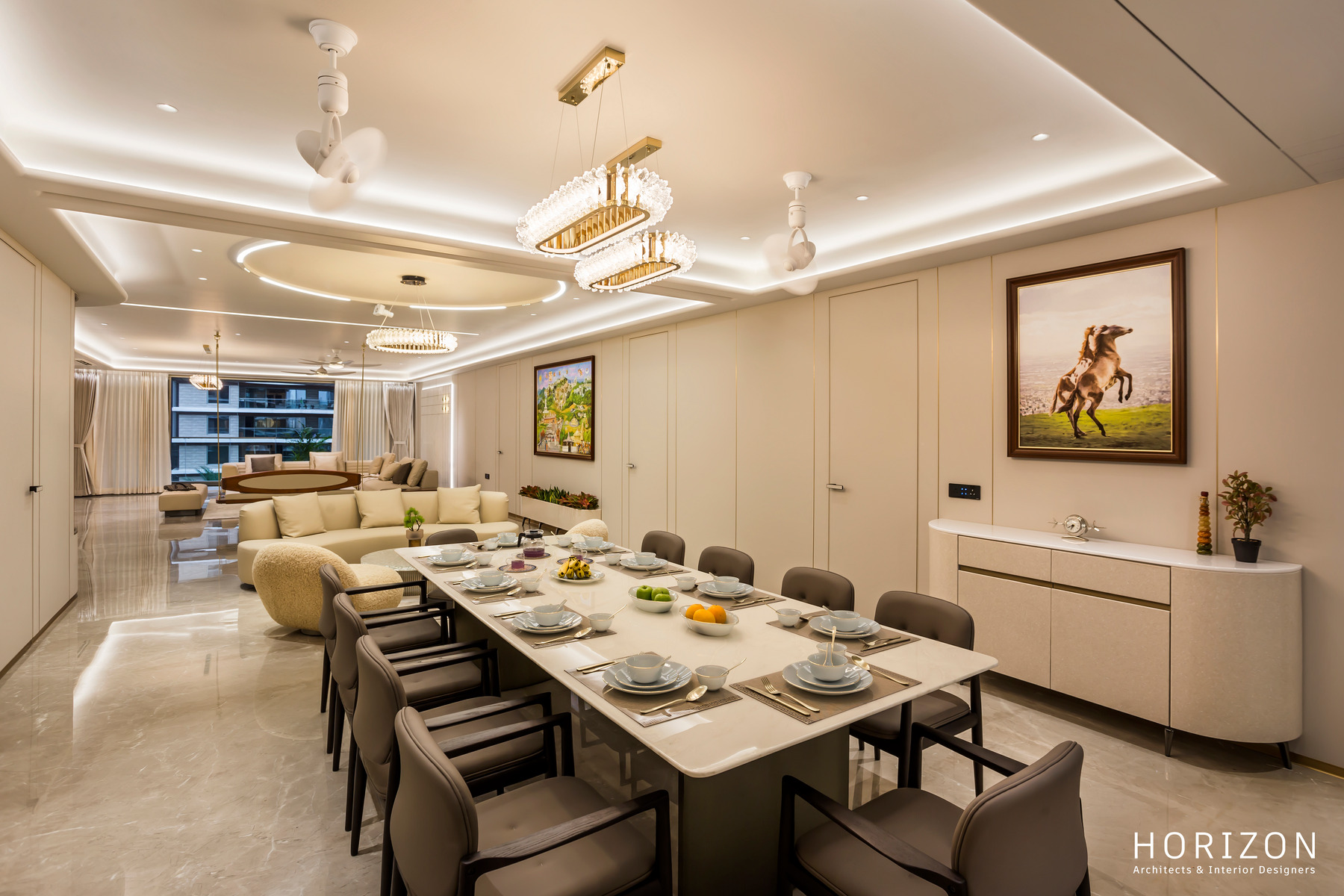 RAHUL BHAI HOME dining room with white sideboard, horse painting and the living room beyond
