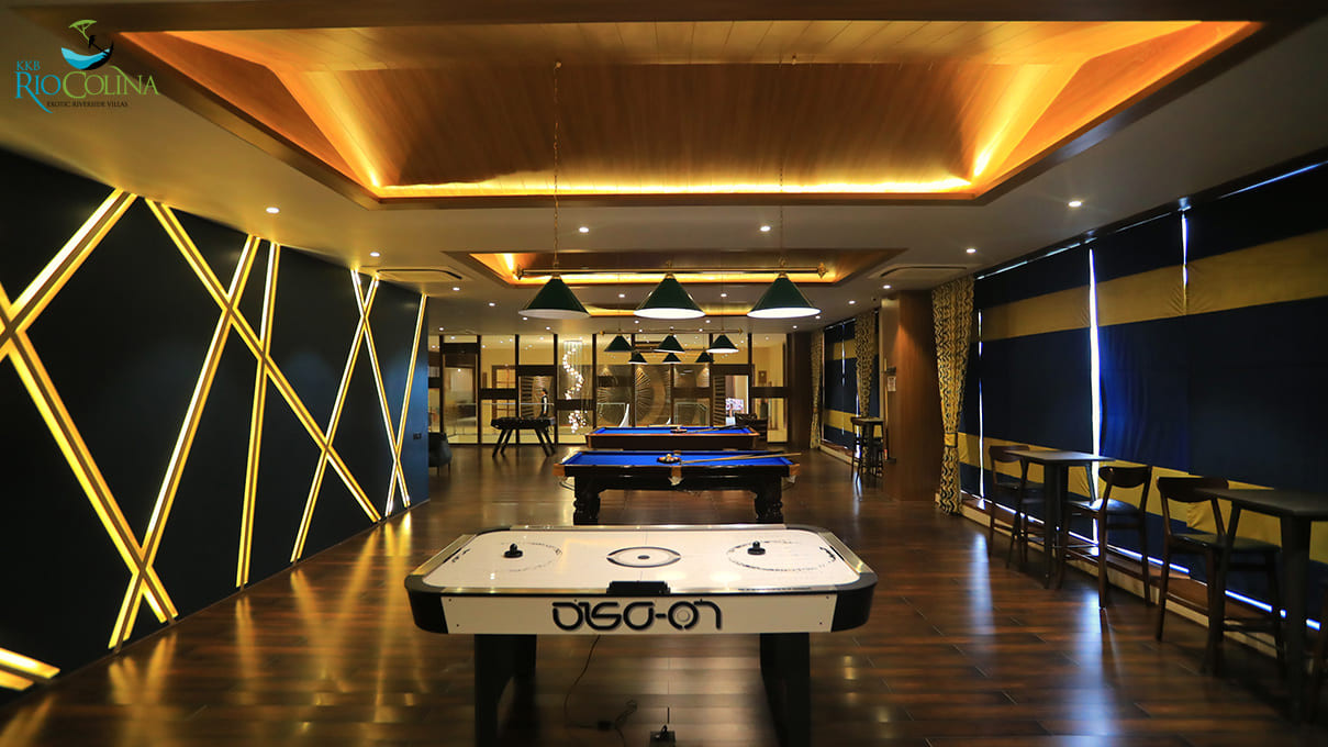Air hockey table under backlit ceiling