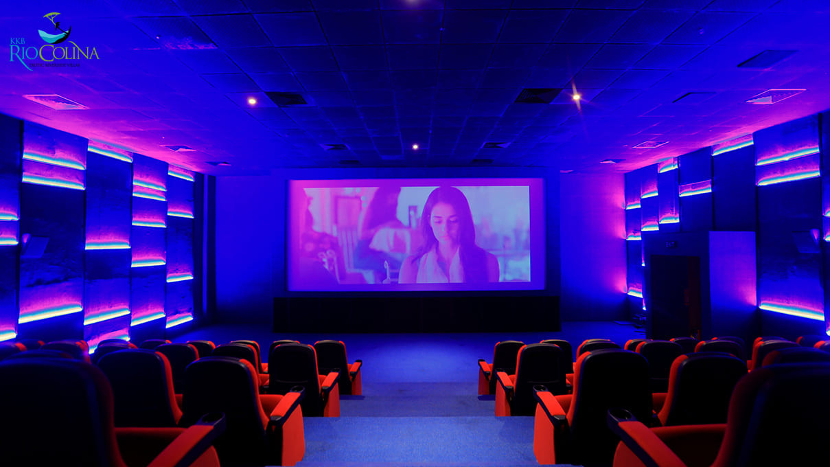 Mini theatre with red recliners and blue lighting