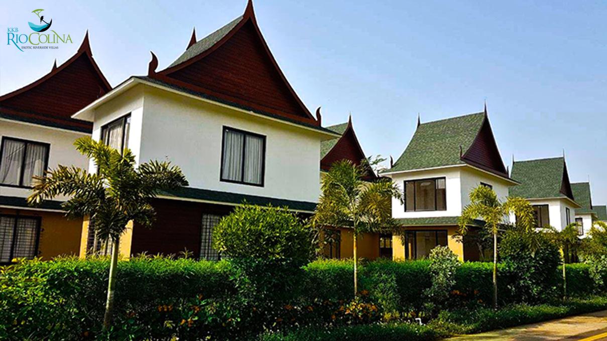 Rio Colina villas with Thai-style roofs and palms