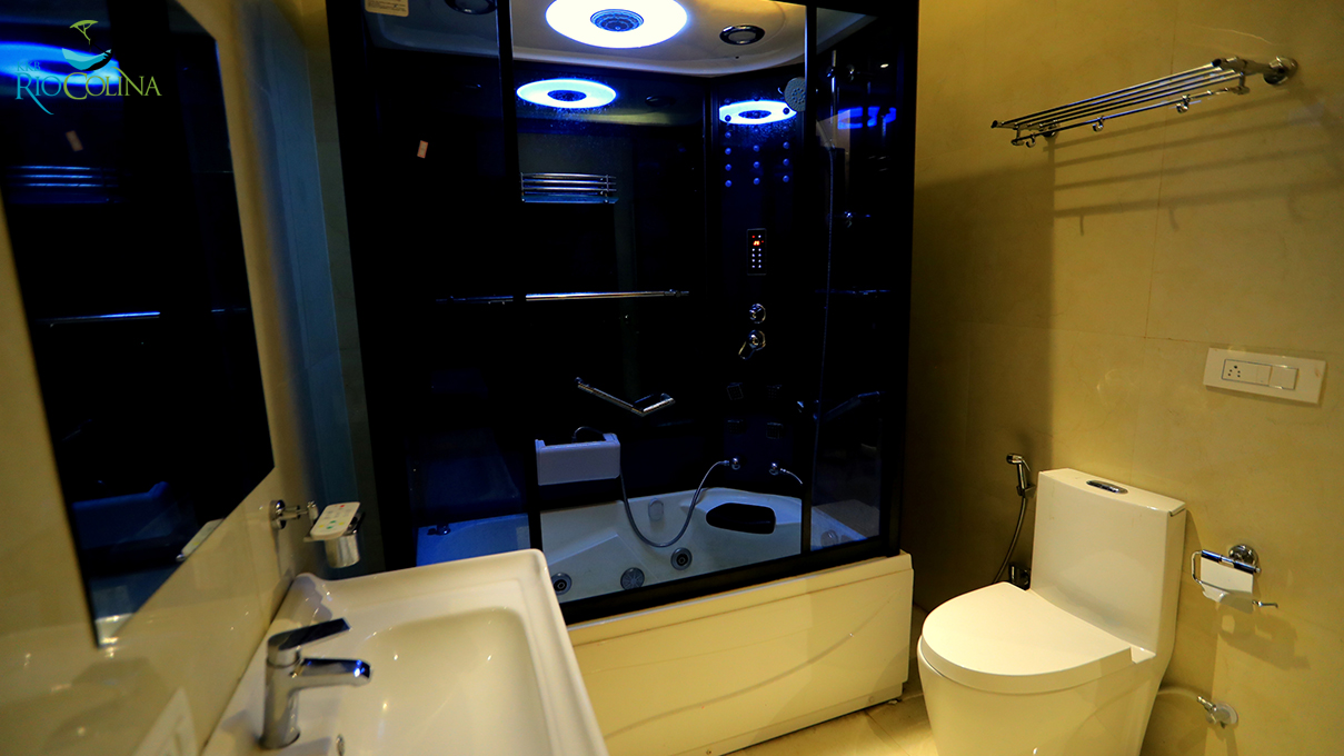 Villa bathroom with steam shower cabin and basin