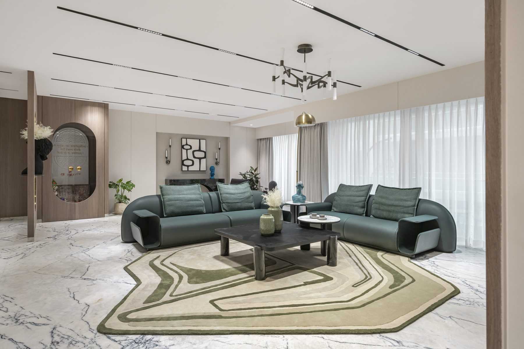 SACHIN BHAI HOME living room with two teal leather sofas and sculpted rug