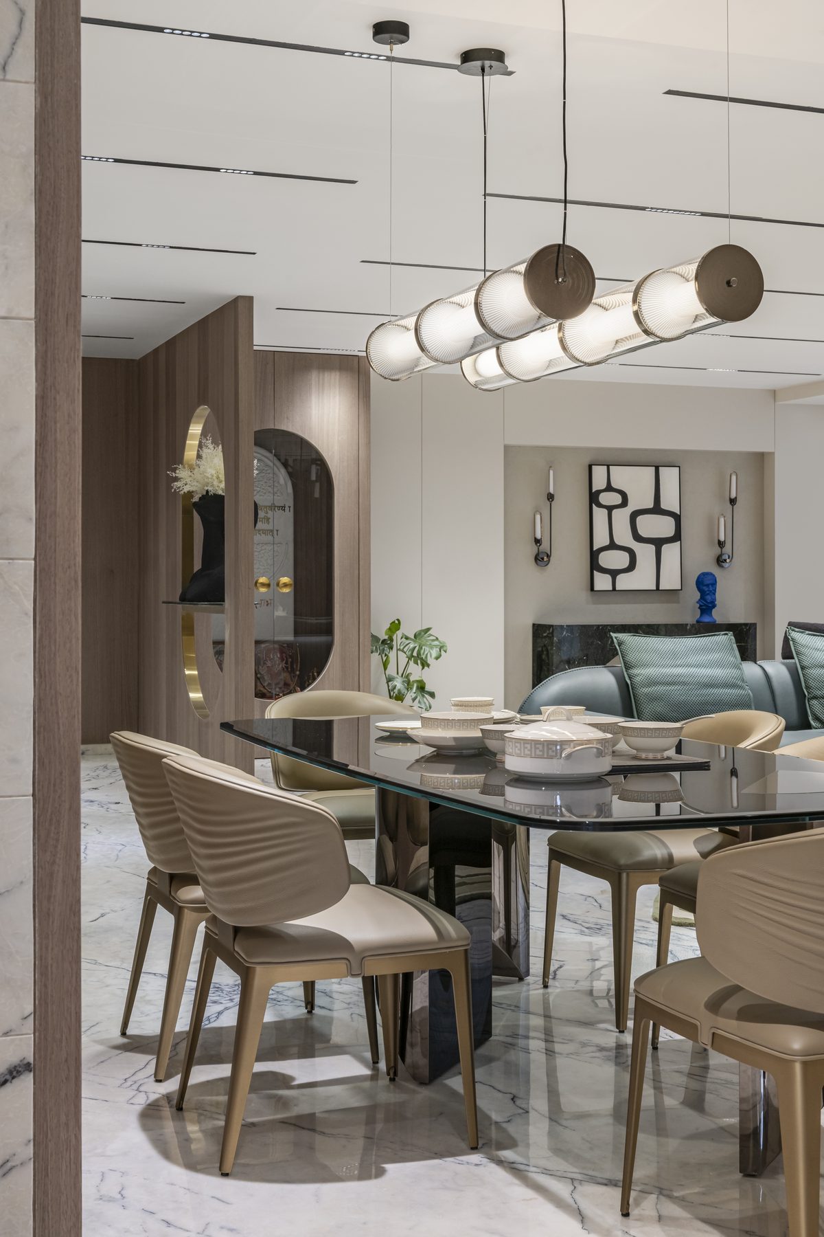 SACHIN BHAI HOME smoked-glass dining table with ribbed leather chairs