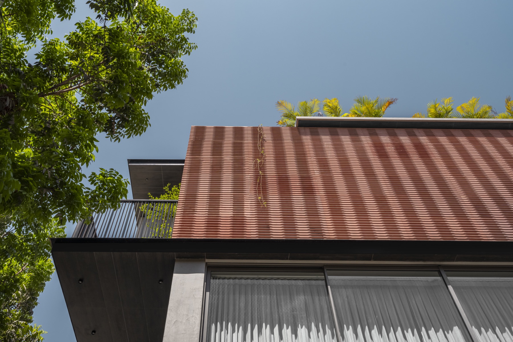 SHRI HOME facade and tree canopy