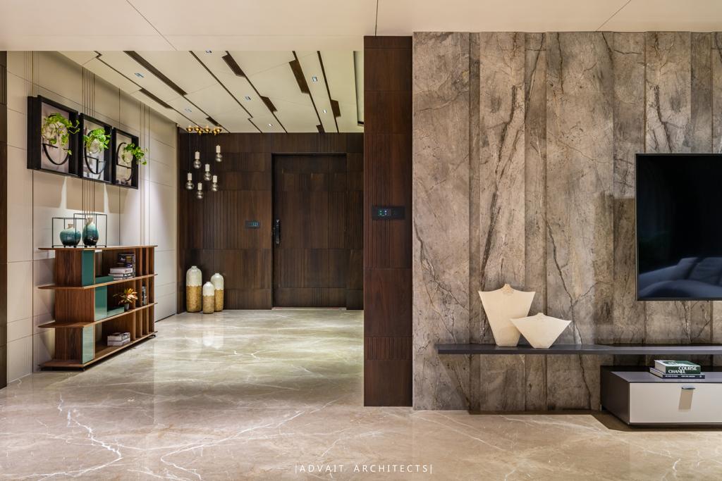VILLASHBHAI HOME lobby with open display shelving, framed artwork and marble walls