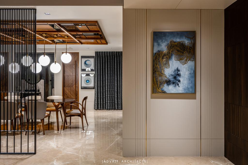 VILLASHBHAI HOME entrance hall with a slatted screen, framed artwork and view through to the dining room