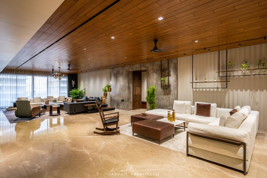 VILLASHBHAI HOME living room seen along its length, with timber ceiling and layered seating