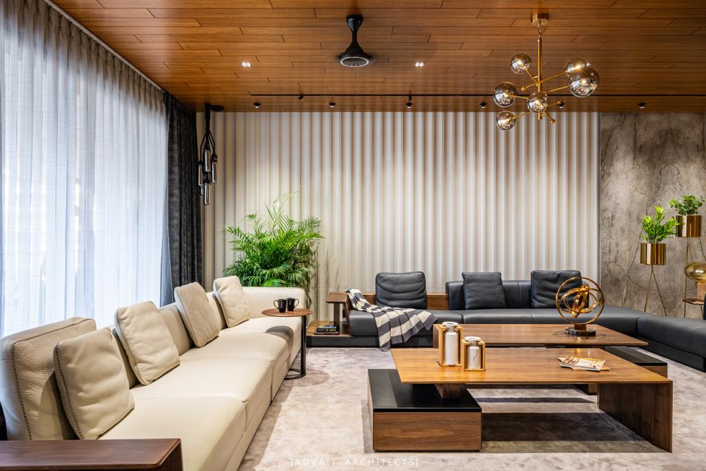 VILLASHBHAI HOME cream sofas around a low timber coffee table below a slatted ceiling