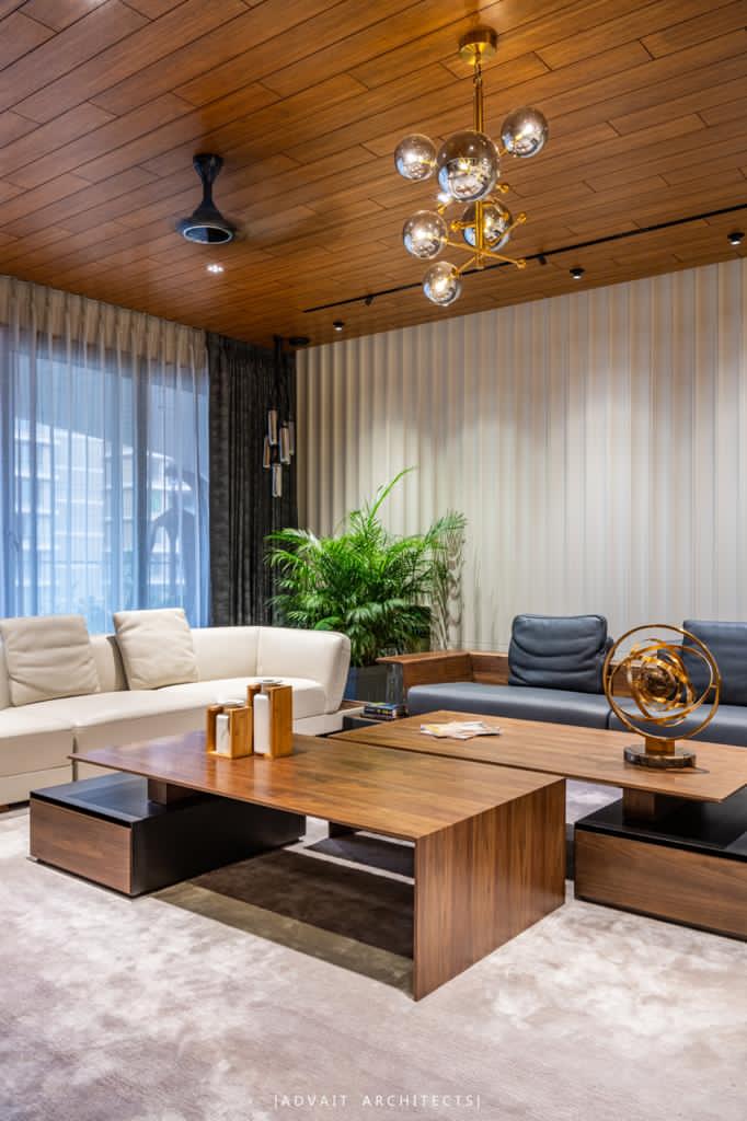 VILLASHBHAI HOME living room coffee table and sofas beneath a brass globe chandelier