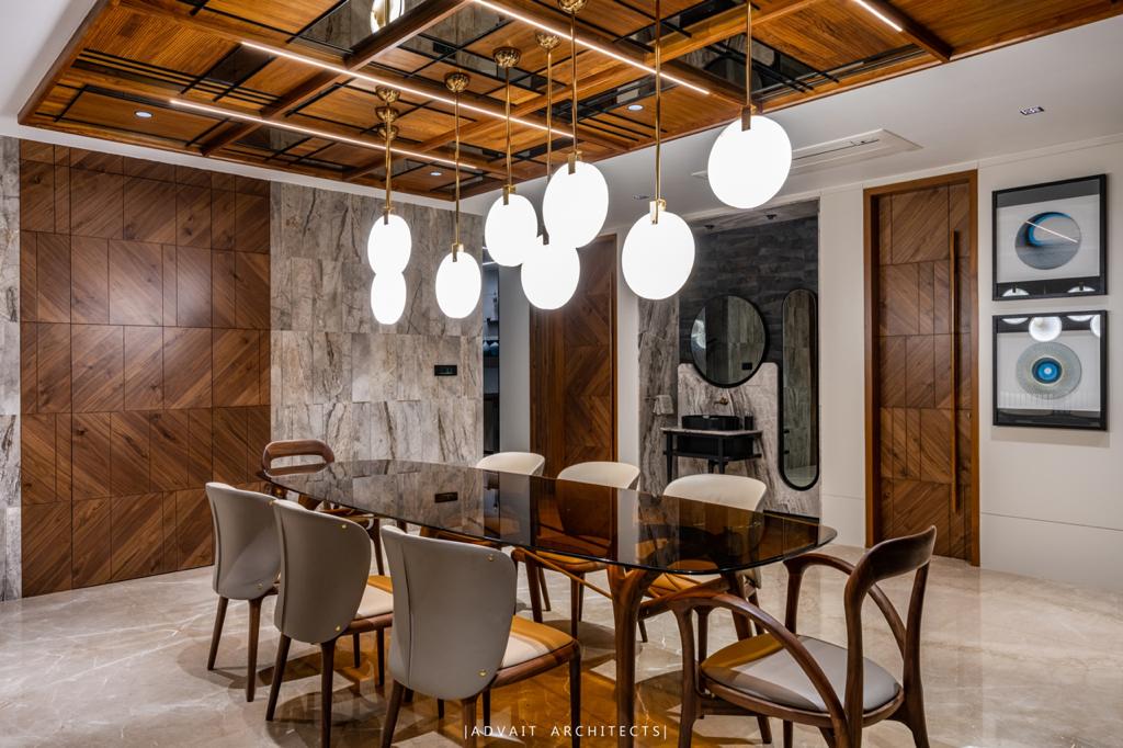 VILLASHBHAI HOME formal dining under a coffered timber ceiling with globe pendants