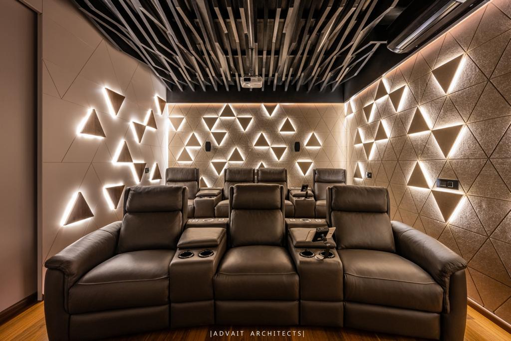 VILLASHBHAI HOME home theatre with recliners and an illuminated triangular wall