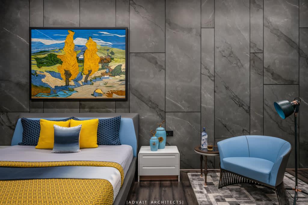 VILLASHBHAI HOME bedroom with framed landscape artwork and a small blue daybed